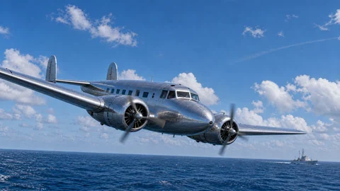 Thumbnail: een zilveren propellervliegtuig laag boven de oceaan